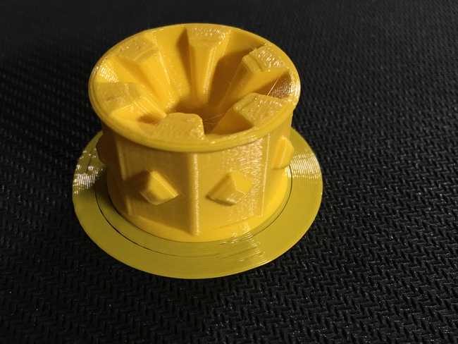 Finished PETG print of a yellow wheel